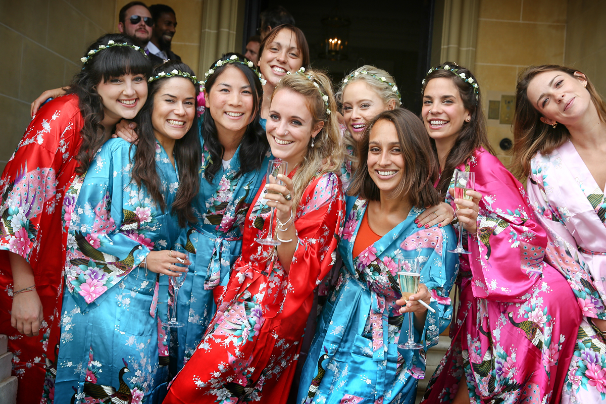 bridesmaids in dressing gowns on hedsor house front steps